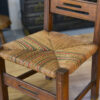 Chaise d'enfant en bois et assise en paille dans le goût de Charles Dudouyt 1950's