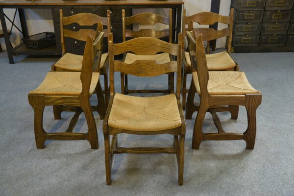 Ensemble de 6 chaises en chêne massif et assises en paille Guillerme et Chambron 1950's