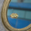 Paire de miroirs ovales vintage 1950's
