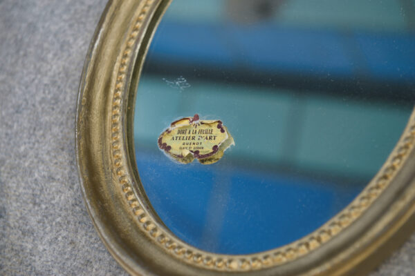 Paire de miroirs ovales vintage 1950's