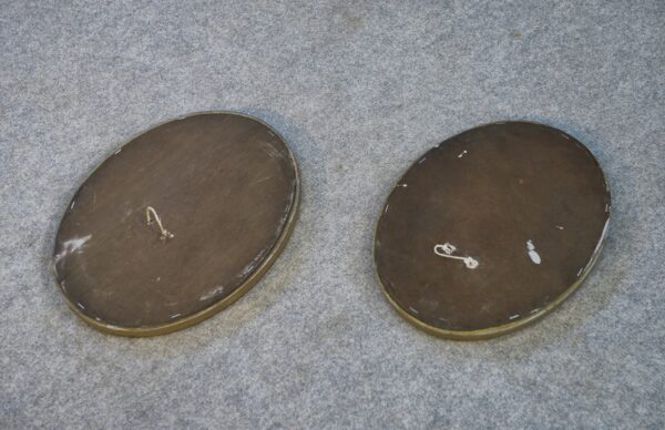 Paire de miroirs ovales vintage 1950's