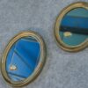 Paire de miroirs ovales vintage 1950's