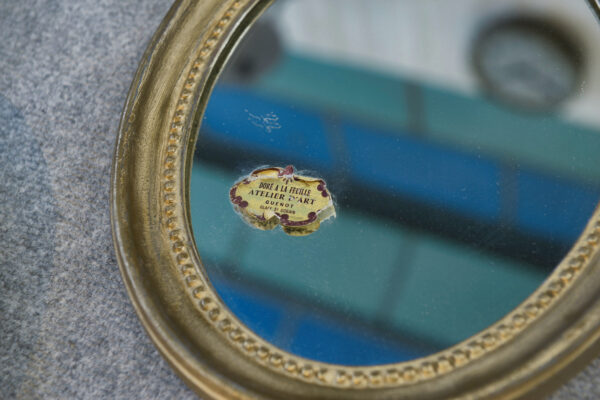 Paire de miroirs ovales vintage 1950's