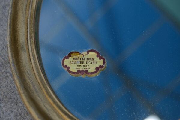 Paire de miroirs ovales vintage 1950's