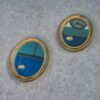 Paire de miroirs ovales vintage 1950's