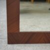 Miroir moderniste en placage d'acajou 1950's