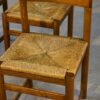 Ensemble de 4 chaises en orme massif et assise en jonc dans le goût Maison Regain 1960's